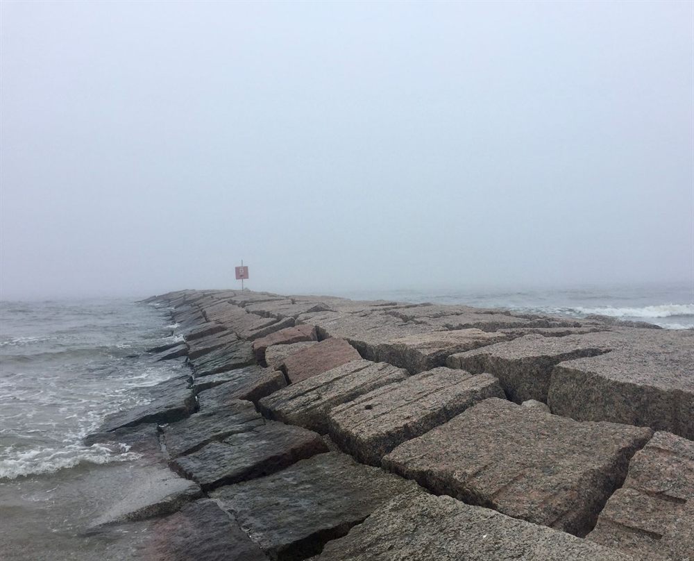 Rocky jetty reaching into the Gulf of Mexico at Galveston, Texas