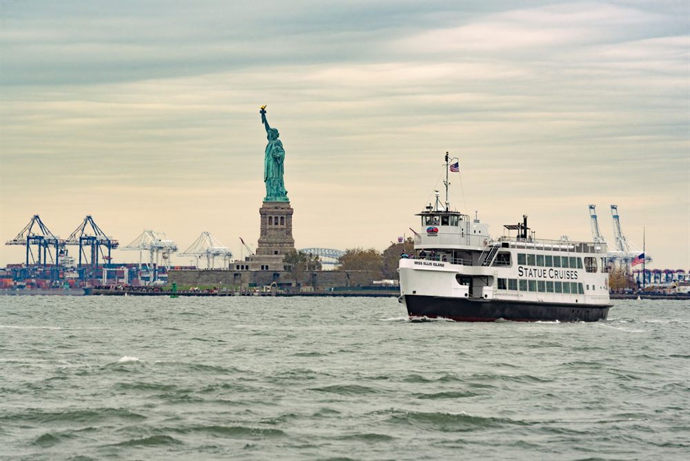 Ferry passing the Statue of Liberty in New York Harbor